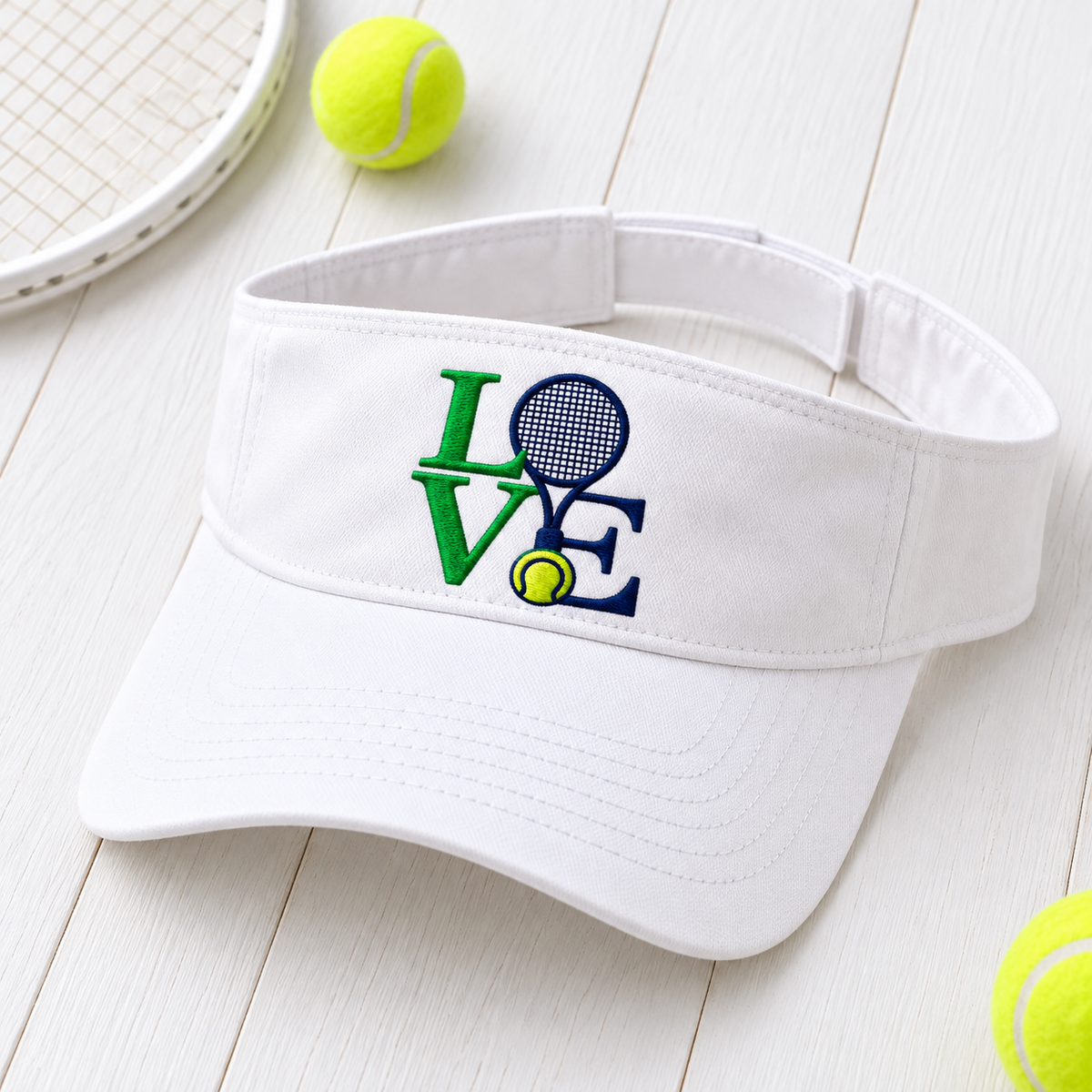 love visor embroidered white headwear hero on white wood with tennis props