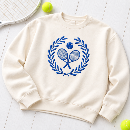 Ivory Comfort Colors crewneck with royal blue embroidered Tennis Club Crest on front and plain sleeves