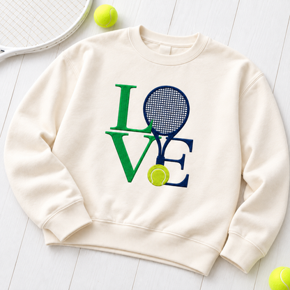 Ivory Tennis Love embroidered crewneck flat lay on white wood with tennis racket and balls